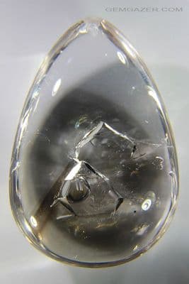 Smoky and colourless Quartz Enhydro cabochon, Madagascar. 200.35 carats. (Video)  ** SOLD **
