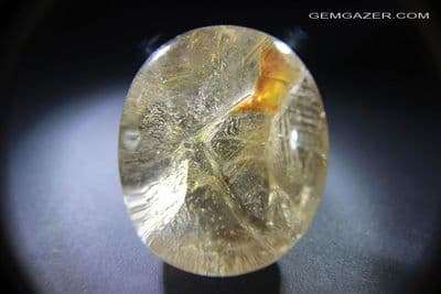 Smoky Quartz cabochon with negative crystal & Rutile inclusions, Brazil. 390.95 carats.