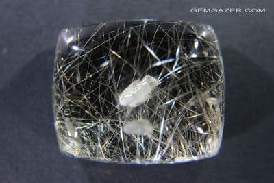 Smoky Quartz cabochon with negative crystal & Rutile inclusions, Brazil. 49.13 carats.