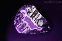 Spherulite nodule, part-polished, Scotland (Fluorescent). 104.88 grams.
