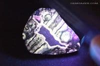 Spherulite nodule, part-polished, Scotland (Fluorescent). 104.88 grams.