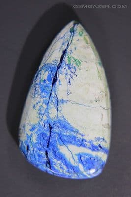 Spiderweb Azurite in Dolomite cabochon, Russia. 17.63 carats.