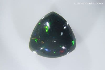 Stayish Black opal cabochon, Ethiopia. 10.92 carats. (Video)