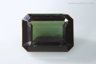 Synthetic Spinel, Verneuil method, dark Tourmaline green faceted. 24.08 carats.