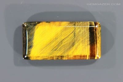 Tiger's-Eye cabochon, Australia. 31.32 carats. (Video)