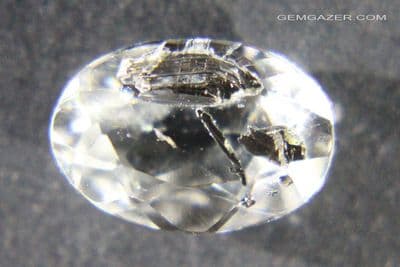 Topaz, colourless faceted with Fuchsite Mica inclusions, Brazil.  2.89 carats.