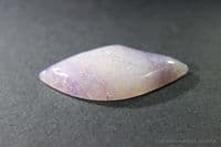 Tremolite, var: Hexagonite, purple and colourless cabochon. USA.   29.70 carats.