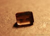 Triphylite, color-change green/red faceted, Brazil.  1.07 carats.