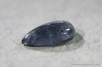 Vesuvianite (aka Idocrase) var: Cypirine, blue cabochon, Norway.  1.92 carats.