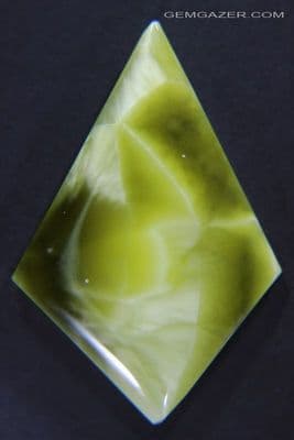 Victoria Stone cabochon, olive green, Japan. 26.59 carats.