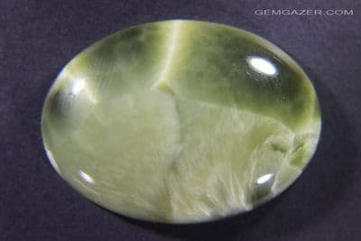 Victoria Stone cabochon, olive green, Japan. 63.23 carats. (Video)