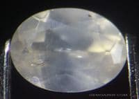 Willemite, pale orange faceted, Namibia.  0.41 carat.