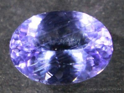 Zoisite, var: Tanzanite, lilac-purple faceted, Tanzania.  1.42 carats.  ** SOLD **