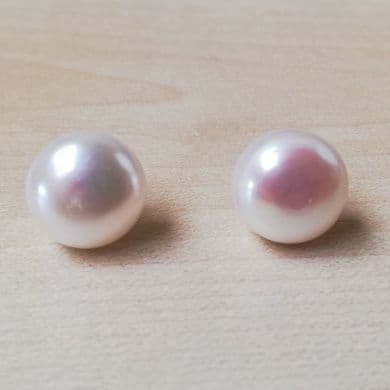 10-11mm white pearl studs on Sterling silver.