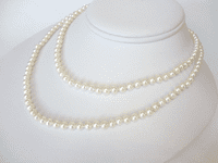 A 36 inch long string of small and perfect AA grade white pearls