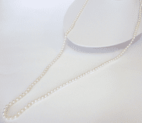 A 36 inch long string of small and perfect AA grade white pearls