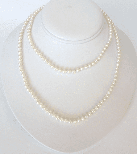 A 36 inch long string of small and perfect AA grade white pearls