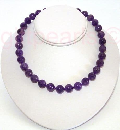 Amethyst necklace with golden, crystal-studded magnetic clasp.