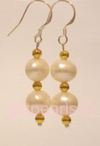 Double white pearl with golden beads.