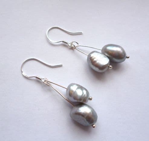 Grey pearl double drop ear-rings on silver hooks.