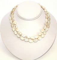 Two-Strand oval button pearls with carved shell clasp.