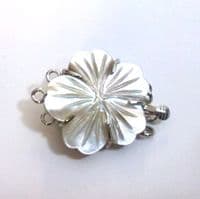 Two-Strand oval button pearls with carved shell clasp.