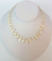 White 'Biwa' pearl with small pearls