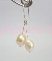 White double drop pearl ear-rings on silver hooks.