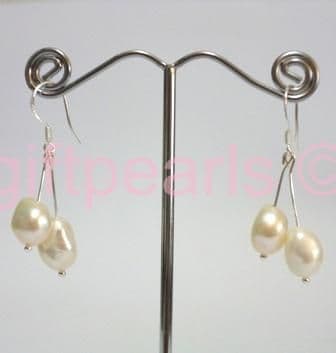 White double drop pearl ear-rings on silver hooks.