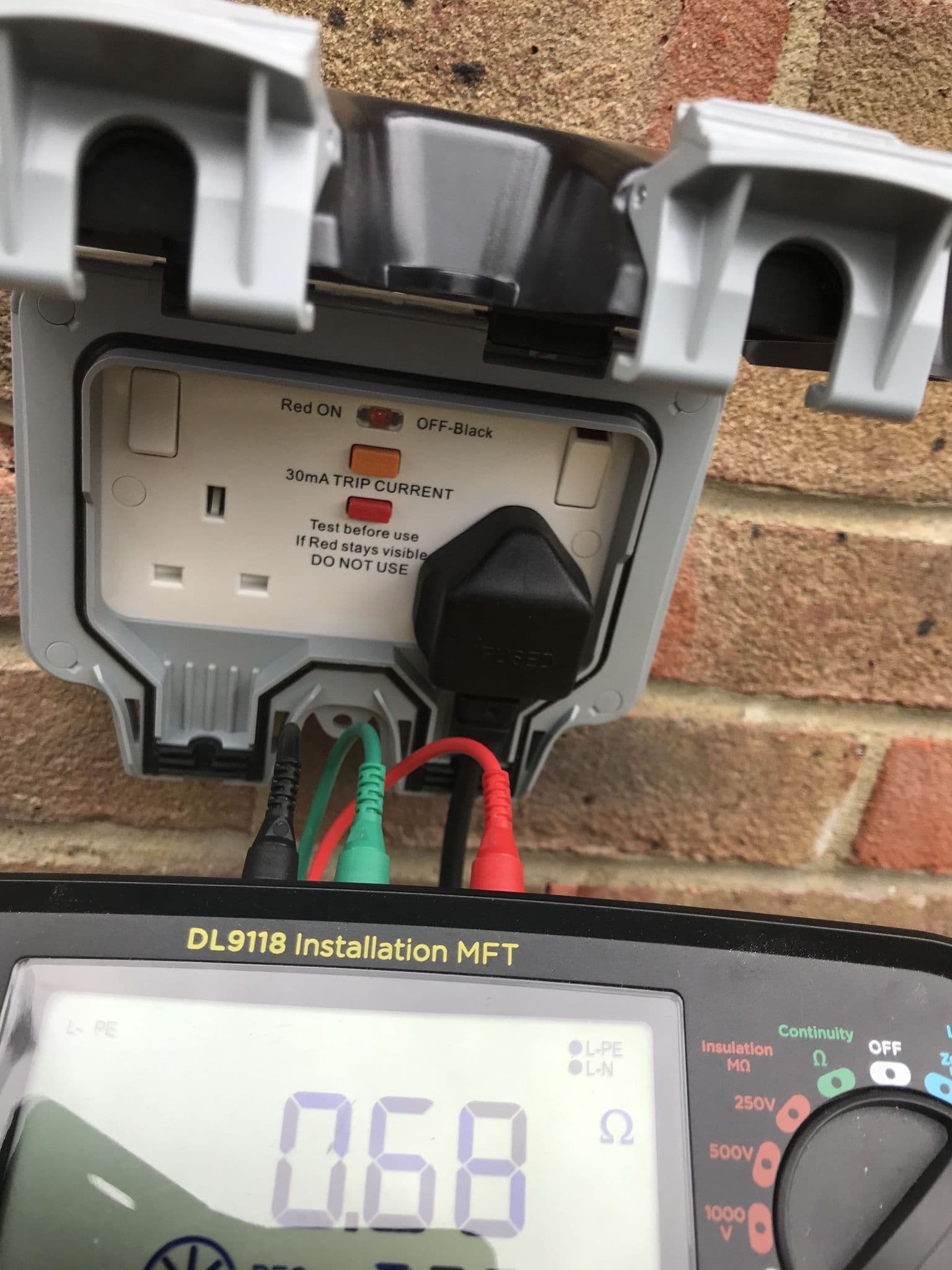Testing Earth Fault Loop Impedance at an External RCD Socket Outlet in the Garden (Test Being Carried Out By Hawthorn Electrics)