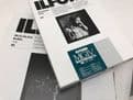 Various boxes of black and white Ilford photographic paper