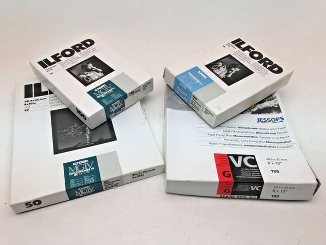 Various boxes of black and white Ilford photographic paper