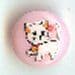 White Cat On A Pink Button B200125