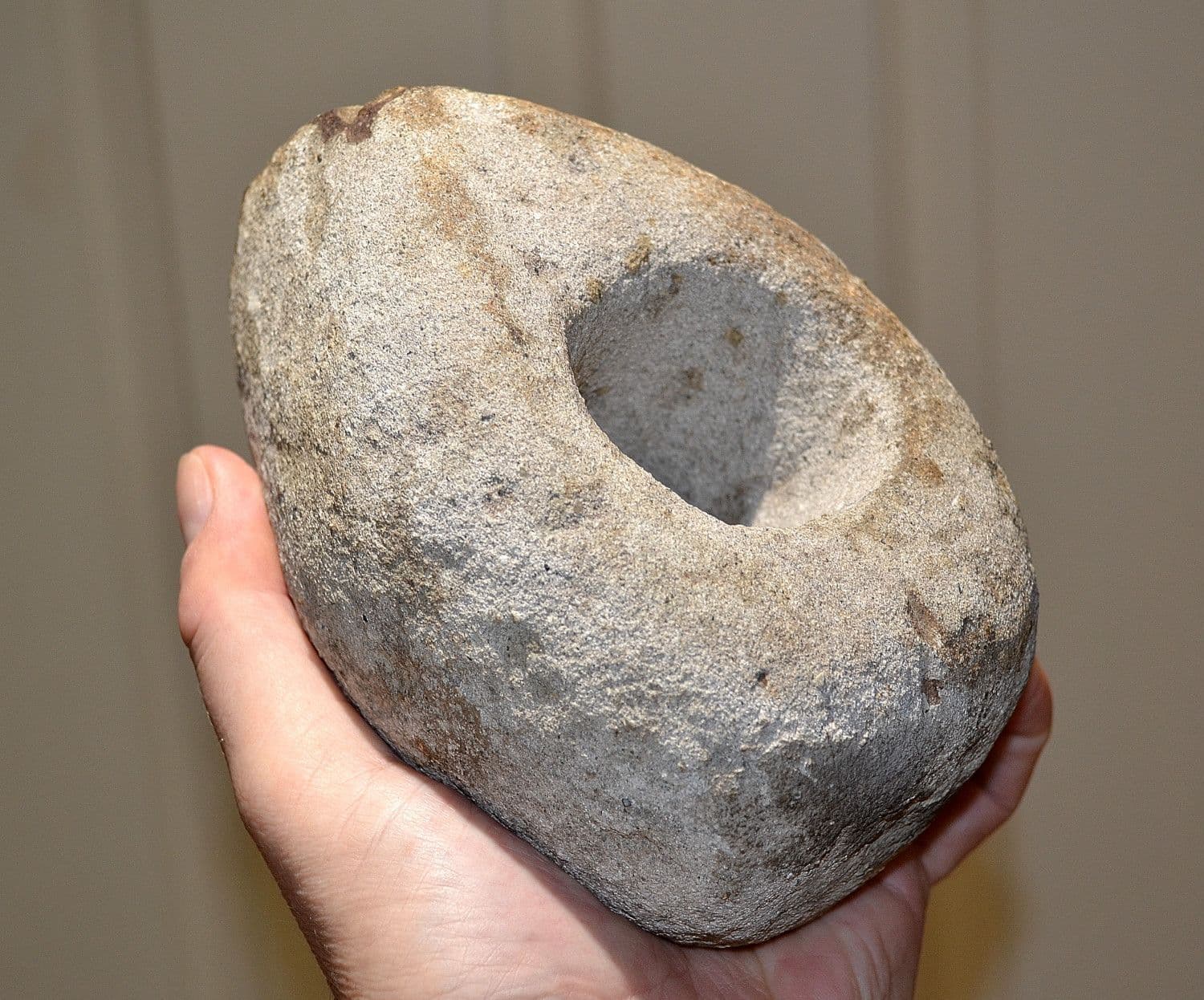 A colossal and very heavy Late Neolithic bored stone axe hammer from