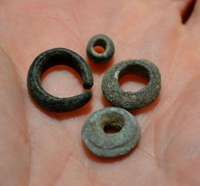 A good group of 4 x Late Bronze Age bronze beads / hair rings from Essex. SOLD