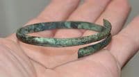 A good sized European Bronze Age bronze spiral bangle / armlet  SOLD