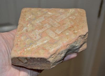 A good sized, thick and heavy Medieval floor tile featuring an interlaced design, London. SOLD