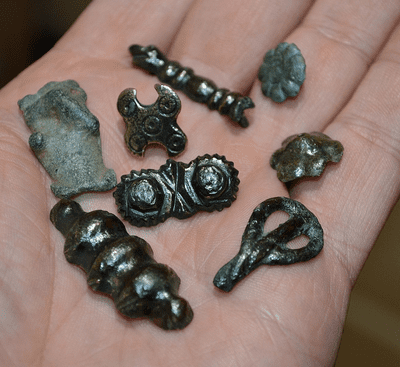 A great value group of 8 x Anglo Saxon / Viking and Early Medieval bronze decorative mounts /appliques found in North Yorkshire. SOLD