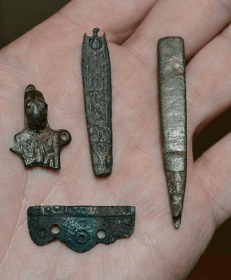 A great value group of four assorted Anglo Saxon bronze artefacts from Lincolnshire. SOLD