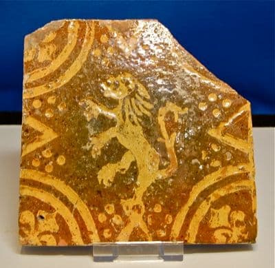 A large and attractive 16th Century glazed floor tile featuring a rampant Lion. SOLD
