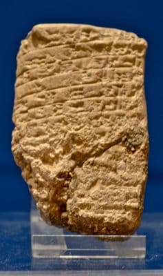 A large and rare Sumerian baked clay tablet featuring 6 lines of Cunieform [Cuneiform] script. SOLD