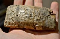 A large and rare Sumerian bi-facial baked clay tablet featuring many lines of Cunieform [Cuneiform] script (Repaired) SOLD