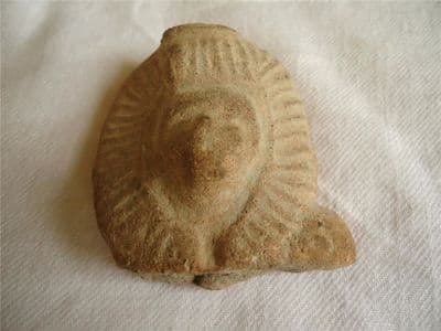 A large and solid Ancient Egyptian terracotta head of Sekhmet the Lion Headed Goddess. SOLD