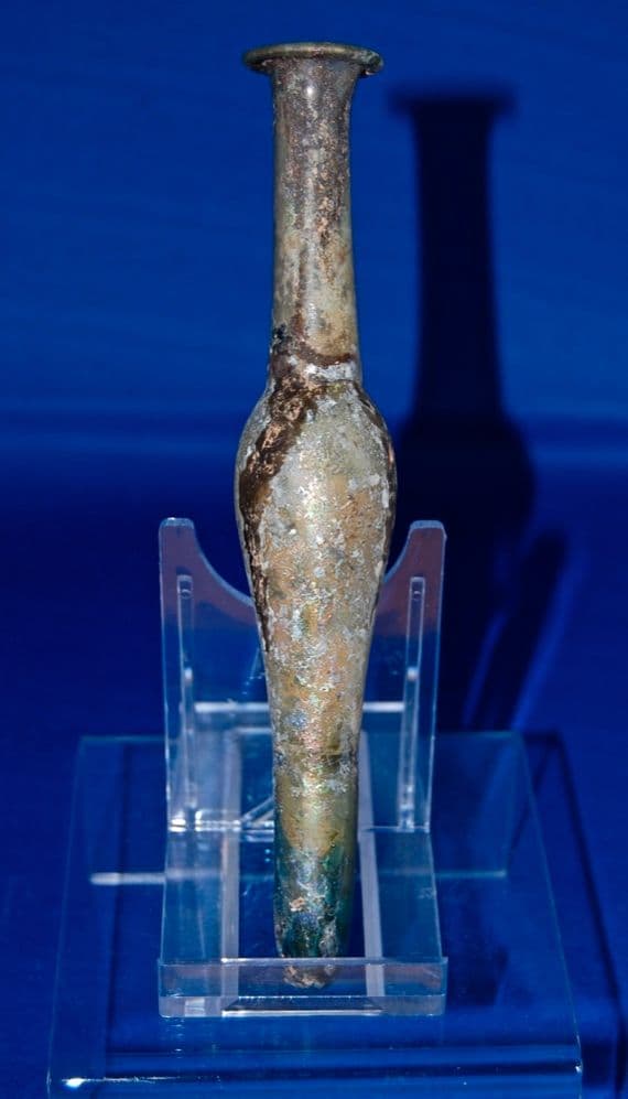 A large and superb, elongate Roman blue/green glass perfume flask, Ex Charterhouse Public School Collection. SOLD