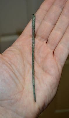 A large Anglo Saxon bronze cloak pin with punched decoration and suspension loop, found near Durham. SOLD