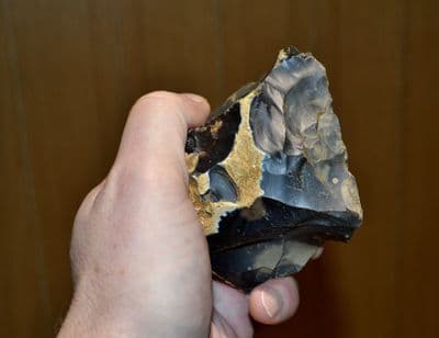 A large & heavy Lower Paleolithic flint hand axe / chopper, Hoxne, Suffolk.