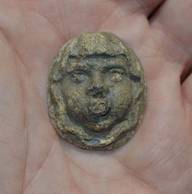 A large Roman hollow backed moulded head of a Cherub?, North Yorkshire