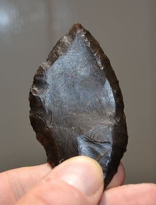 A large, well worked and superb example of a Mesolithic flint spear head, Caspian Culture, Algeria. SOLD