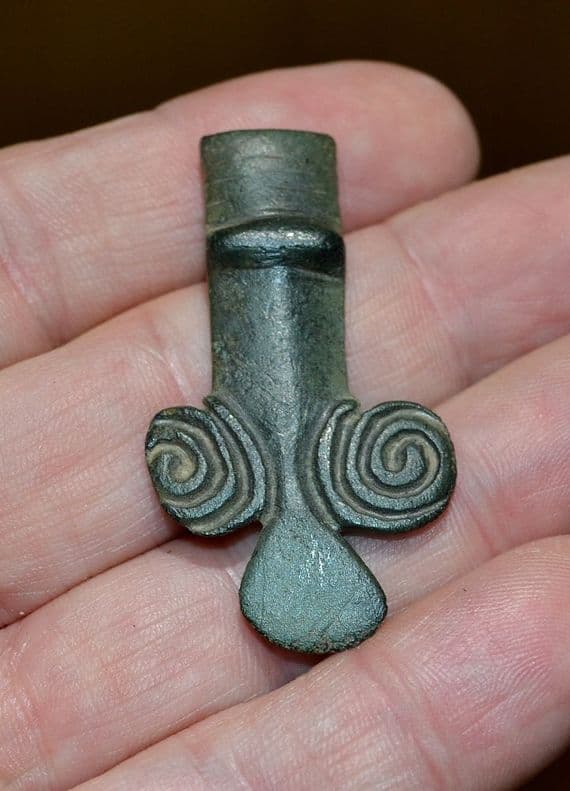 A large zoomorphic bronze terminal from a huge Anglo Saxon bronze cruciform brooch, Norfolk.