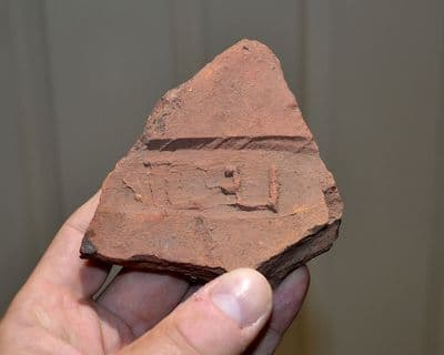 A major segment of a very rare Roman Legionary (LEGION II AVGVSTA) stamped roof tile from the Roman Fortress at Caerleon, Wales. Ex. Seabys 1985 SOLD